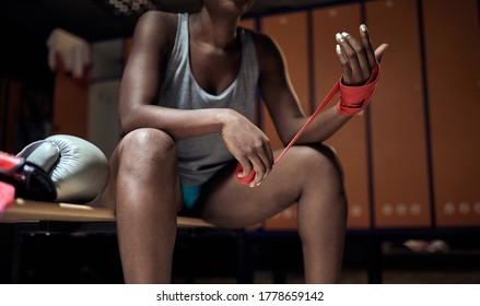 Wrapping hands for boxing. Boxer wearing  strap on wrist.Strong woman boxer. - Powered by Shutterstock