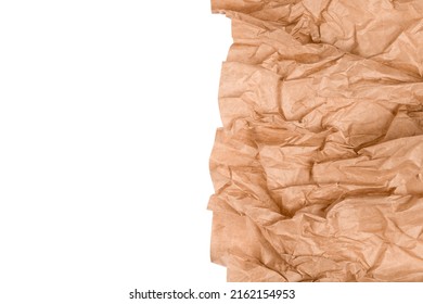 Wrapping Kraft Paper Or Baking Parchment Isolated On White Background With Copy Space. Sustainable Packaging Concept, Wrapped Paper As Background. Selective Focus