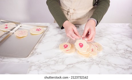 Wrapping Large Homemade Lollipops Into Clear Gift Bags.