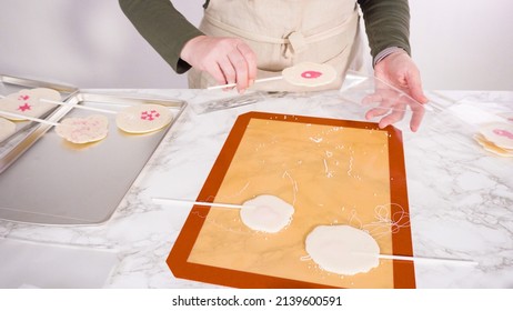 Wrapping Large Homemade Lollipops Into Clear Gift Bags.