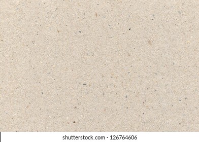 Wrapping paper cardboard texture, light rough textured copy space background, grey, gray, brown, tan, yellow, beige