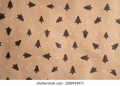 Wrapping paper for gifts with a winter print. Brown recycled paper texture background. Textured paper background. Kraft paper texture. 