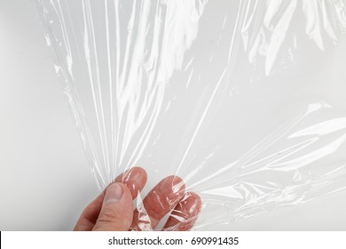 Wrapping Plastic Transparent Food Film On White Background. 