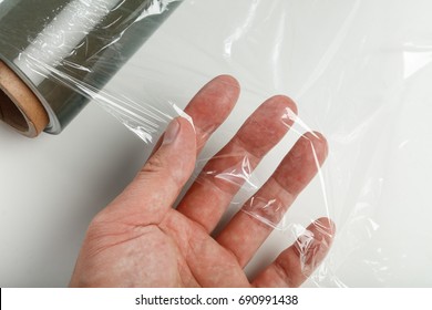 Wrapping Plastic Transparent Food Film On White Background. 