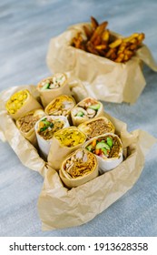 Wraps In A Box With Sweet Potato Fried. Shoot From The Top. 