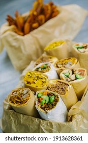 Wraps In A Box With Sweet Potato Fried. Shoot From The Top. 