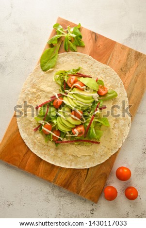 Wraps or torttila. Open avocado, vegan wraps. Healthy foods. Flat lay. Copy space Stock photo © 