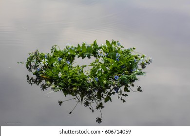 A Wreath Of Flowers On Water