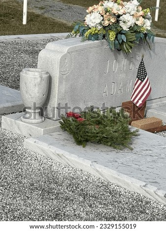 Wreathes Across America program placing Wreathes on service members graves every December.