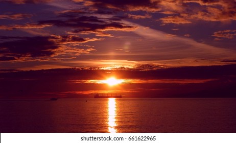 Wreck Beach In Vancouver - Sunset With Boat