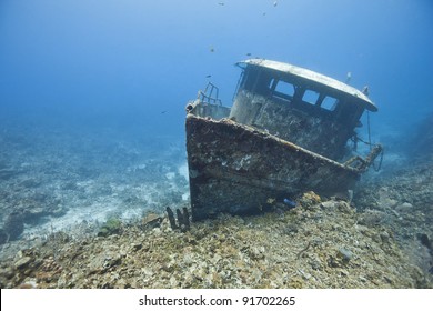 The wreck of the Mr. Bud, a former shrimping boat, scuttled off the island of Roatan, Honduras and now used as a scuba diving site. - Shutterstock ID 91702265