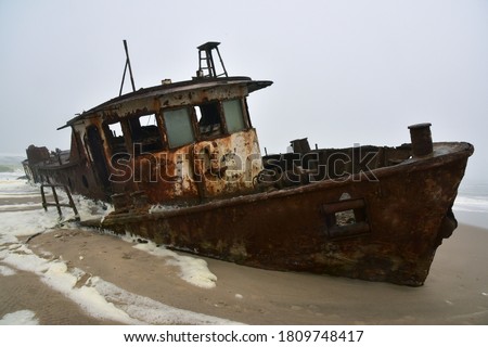 Wreck of a trawler that ran aground in 1976 on the beach off the Atlantic Ocean in the Namib Desert