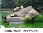 Wreckage of an American B-52 bomber in Huu Tiep Lake, Hanoi, Vietnam. Shot down by Vietnamese SAM during Operation Linebacker II in 1972. The wreckage is left where it crashed and now a War Memorial.