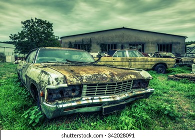 Wrecked american cars at an oldtimer scrapyard, HDR processing - Powered by Shutterstock