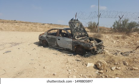 A wrecked car in the desert