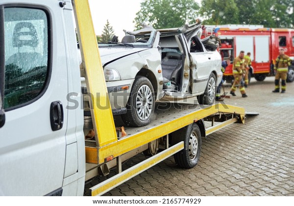 Wrecked car loading on tow truck after crash
traffic accident, Concept of dangerous driving after drinking
alcohol, Roadside assistance
concept