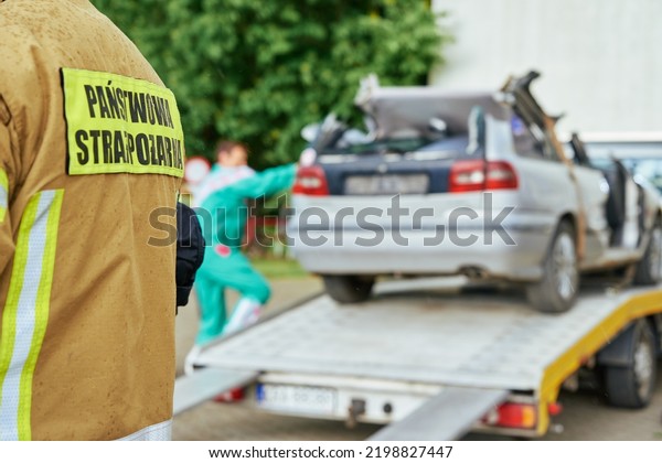 Wrecked\
car loading on tow truck after crash traffic accident, Concept of\
dangerous driving after drinking alcohol, Roadside assistance\
concept. Katy Wroclawskie, Poland - May 28,\
2022