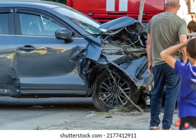 A Wrecked Car At The Scene Of A Traffic Accident