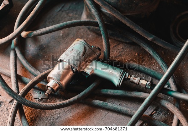 Wrench gun in the car repair\
shop.