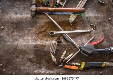 Wrenches, screwdrivers, and tools for mechanics in a garage