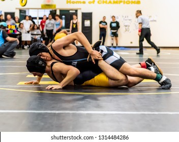 Wrestler From Buena High School Lifting Ankle Of Ventura Athlete During Tournament At Ventura High School In California USA On February 2, 2019.