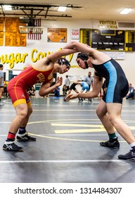 Wrestler From Oxnard High School Attempting To Gain Advantage On Feet Against Buena Athlete During Tournament At Ventura High School In California USA On February 2, 2019.