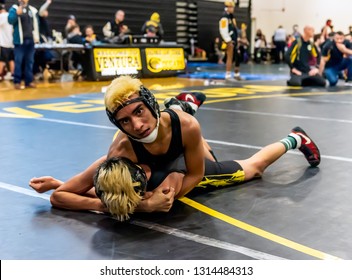 Wrestler From Rio Mesa High School Looking Ahead While Riding Ventura Athlete During Tournament At Ventura High School In California USA On February 2, 2019.