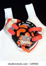 Wrestling Head Gear And Medal On A Singlet