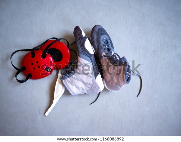 Wrestling Shoes Headgear On Grey Mat 