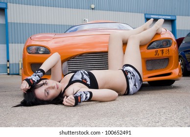 WREXHAM, ENGLAND - JUNE 13 : Club Promo Girl With Mazda RX7 On June 13th 2009 In Wrexham, England, UK. Demon Tweeks Is The Host Of Shropshire Modified And Performance Car Club Charity Event