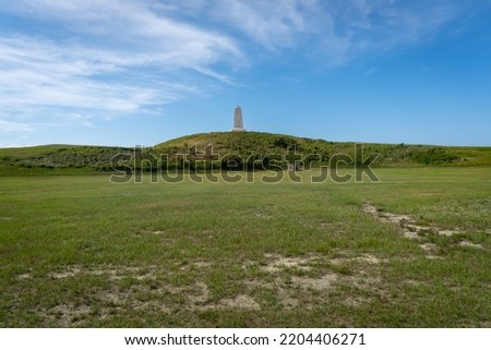 Wright Brothers Monument atop Kill Devil Hill honors the Wright brothers and mark the site of first flight. Grass stabilizes sand dune. 