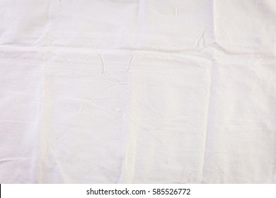 Wrincled White Canvas Drop Cloth That Never Been Used.