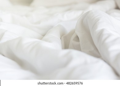 Wrinkle Messy Blanket In Bedroom After Waking Up In The Morning, From Sleeping In A Long Night, Details Of Duvet And Blanket, An Unmade Bed In Hotel Bedroom With White Blanket. 