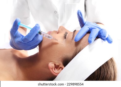 Wrinkle Reduction, The Lion's Wrinkle Injection Botox. Portrait Of A White Woman During Surgery Filling Facial Wrinkles, Cosmetic Is Injected Into Facial Skin Cosmetics