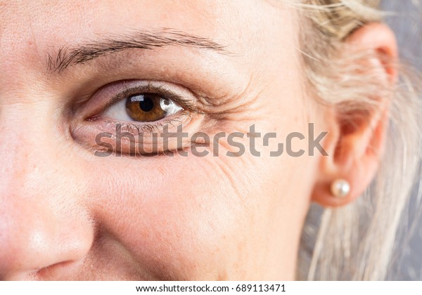 Wrinkled eye of beautiful\
lady