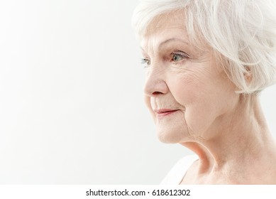 Wrinkled old woman thinking about life