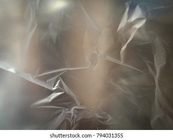 Wrinkled Opaque Plastic Bag With Mystery Background In White Tone