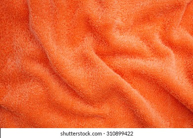 Wrinkled Orange Blanket  On Background