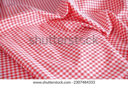 wrinkled pink and white tablecloth background with selective focus