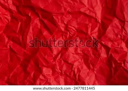 wrinkled red paper texture,Rectangular crumpled sheet of red paper on a white isolated background