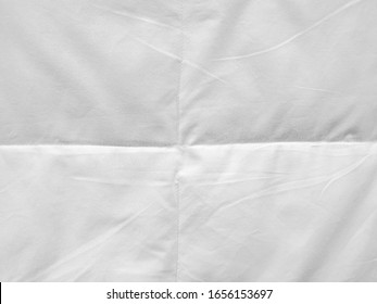 Wrinkled white fabric texture background.White creased paper background texture.