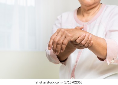 wrist hand pain of old woman, healthcare problem of senior concept - Shutterstock ID 1715702365