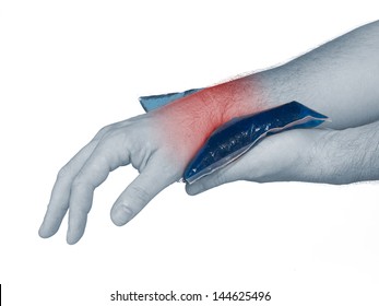 Wrist Pain. Male Holding Ice Pack On Wrist Read Spot Indicating Location Of The Pain.