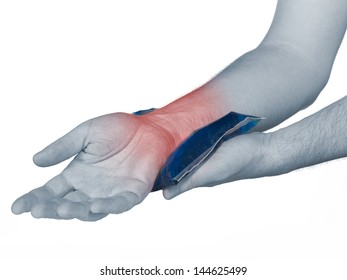 Wrist Pain. Male Holding Ice Pack On Wrist Read Spot Indicating Location Of The Pain.