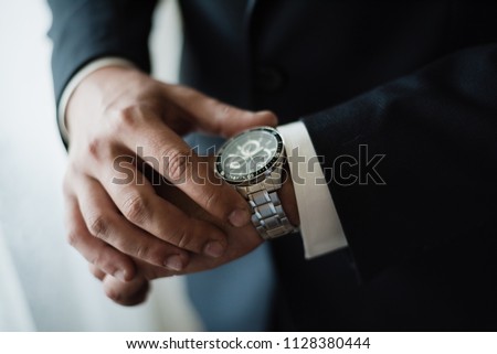 Wrist Watch, men's wrist watch, the man is watching the time