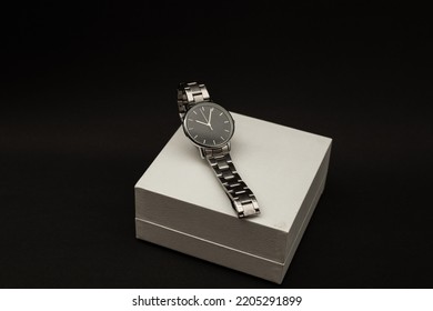 Wristwatch With Metal Strap On Black Background