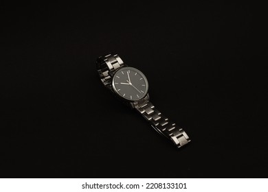 Wristwatch With Metal Strap On Black Background