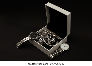 Wristwatch With Metal Strap On Black Background