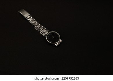 Wristwatch With Metal Strap On Black Background