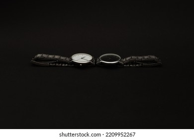 Wristwatch With Metal Strap On Black Background